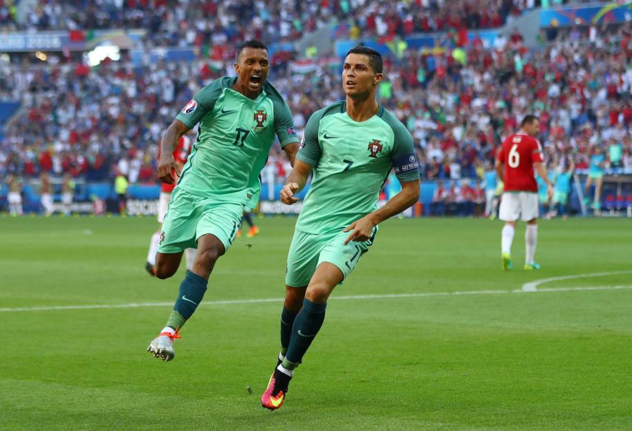 Portugal's Cristiano Ronaldo and Nani celebrate a goal against Hungary in UEFA Euro 2016.