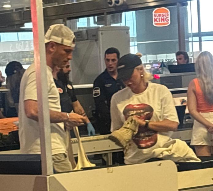 Gabby Allen and Blu Chegini at airport security.