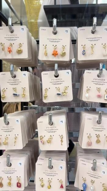 A display of Primark interchangeable charms, priced at £1 for a pack of three.