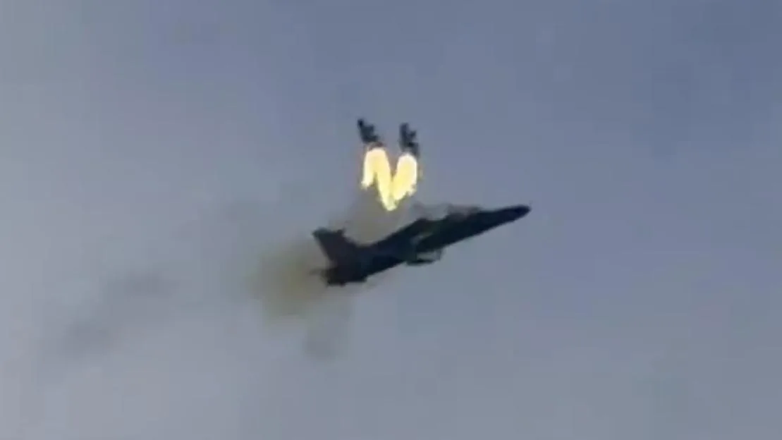 A pilot ejecting from a Hawk T2 training aircraft as it crashes in mid-air.