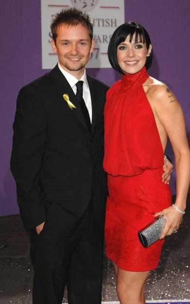 Jack Ryder and Kym Ryder smiling at the British Soap Awards.