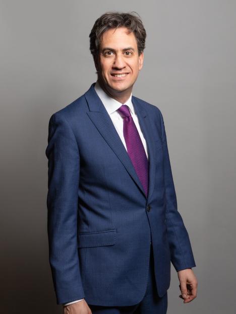 Ed Miliband, UK Foreign Secretary, wearing a blue suit and a purple tie.