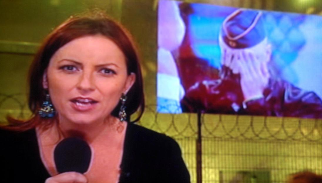 Presenter Davina McCall on screen, with a smaller screen behind her showing a person in uniform.