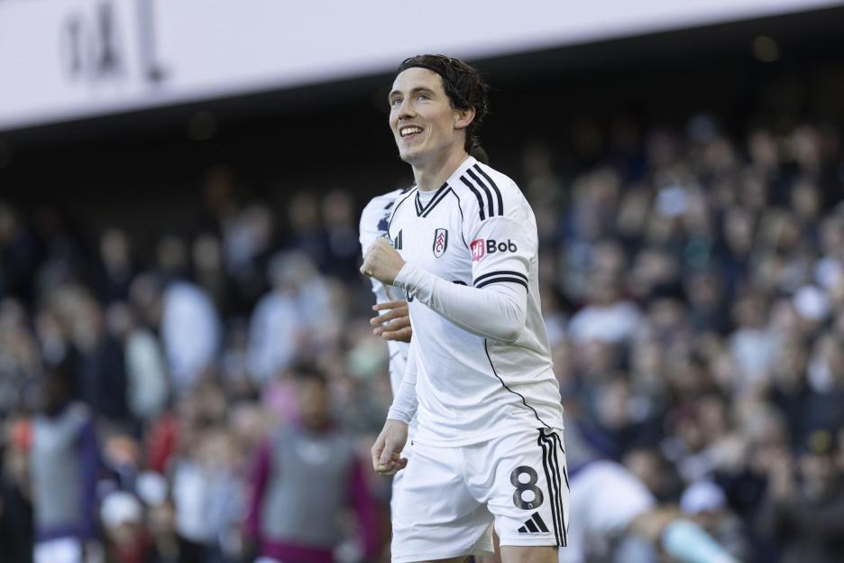 Harry Wilson of Fulham looks up to the stands in celebration during the Premier League match between Fulham and Burnley at Craven Cottage on March 21, 2026 in London, England.