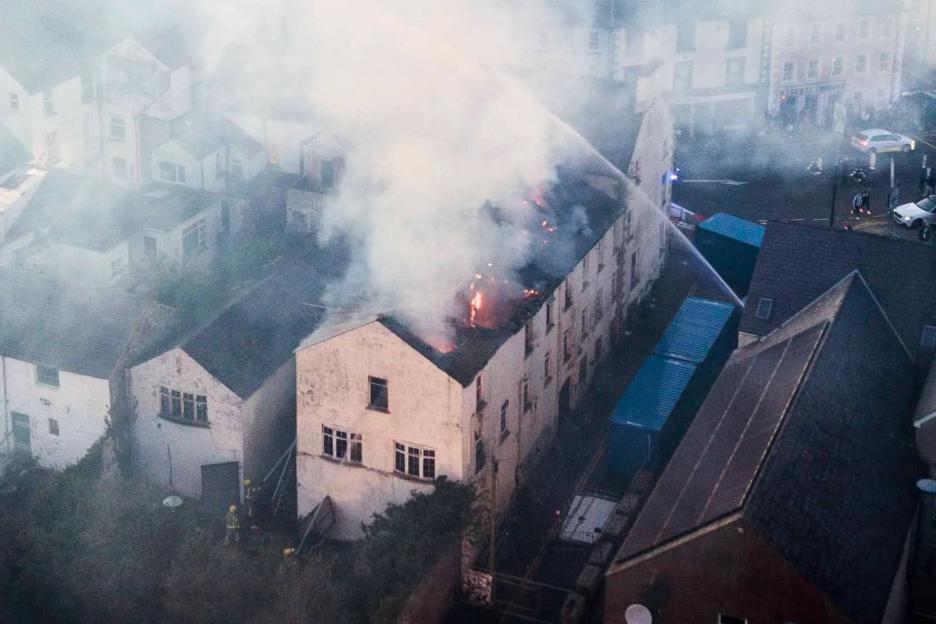 Massive Blaze Engulfs Historic Antrim Hotel as 40+ Firefighters Respond; 'Avoid Area' Warning Issued
