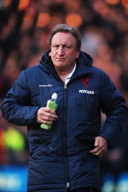 Crystal Palace manager Neil Warnock looks on during a game.