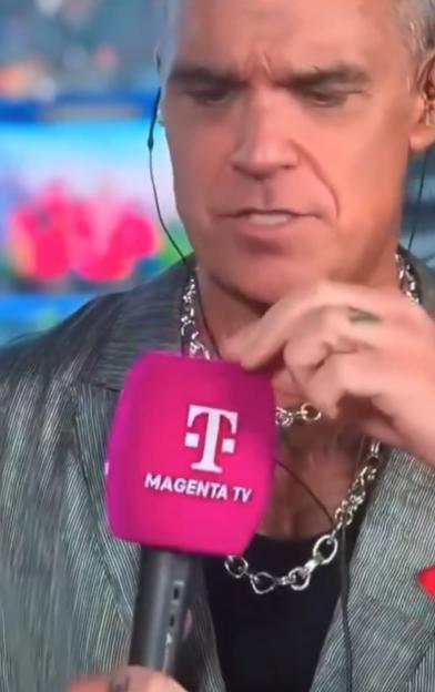 Robbie Williams' On-Stage Mystery Unveiled After ‘White Substance’ Drops on Mic During Live Broadcast