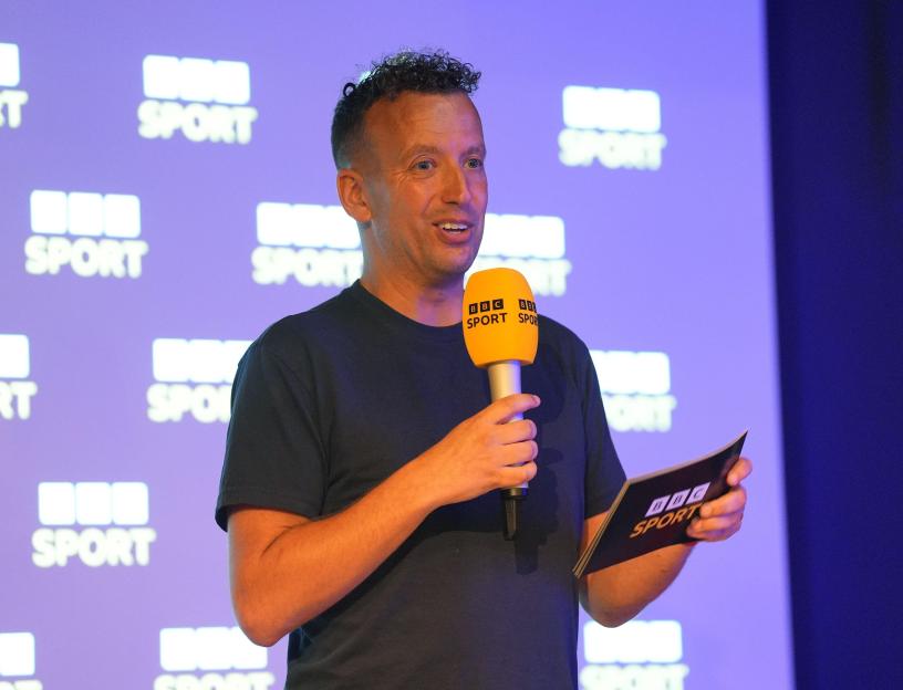 BBC Director of Sport Alex Kay-Jelski speaking into a BBC Sport branded microphone at the 2025/26 Football Season Launch.