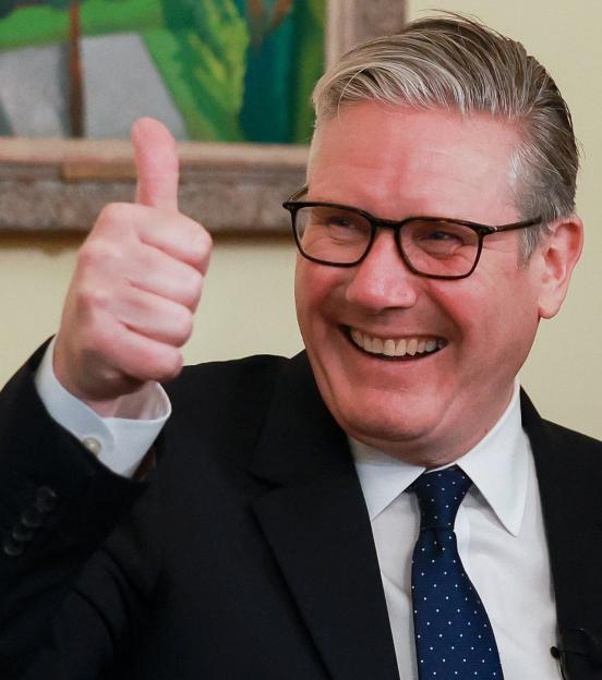 Britain's Prime Minister Keir Starmer gives a thumbs up.