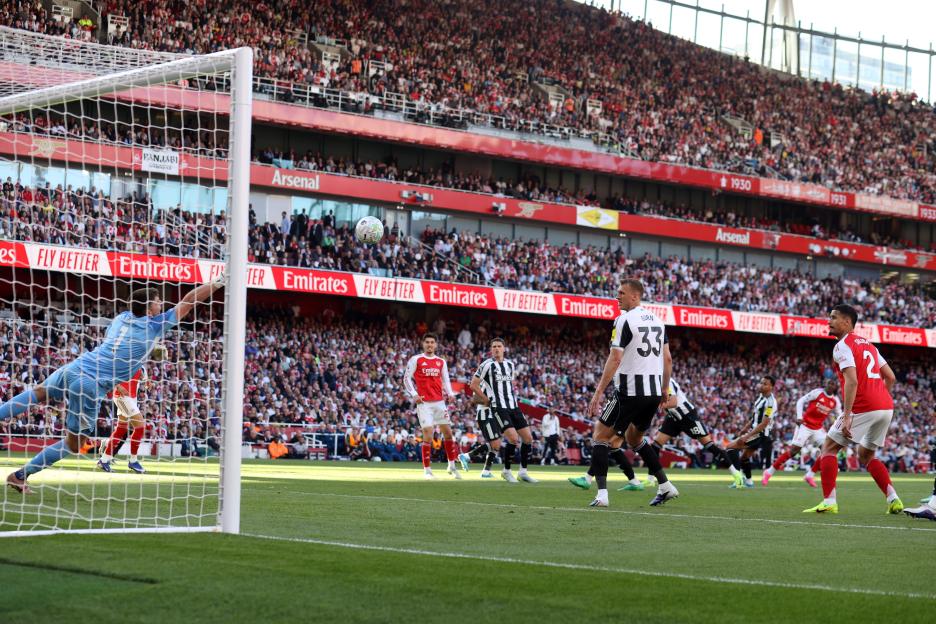 Newcastle United goalkeeper Nick Pope fails to block a goal by Eberechi Eze of Arsenal.