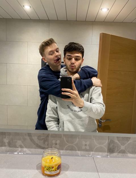 Tiktok star Max Balegde and his boyfriend taking a mirror selfie.