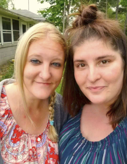 Photo of Sarah and Casei smiling side-by-side.