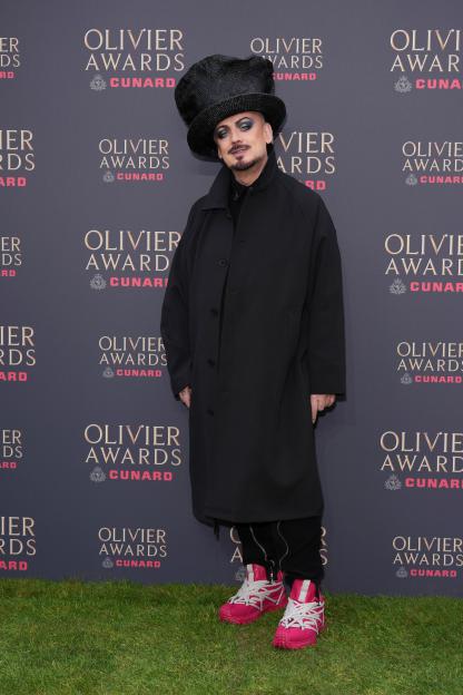 Boy George posing for photographers at the Olivier Awards.
