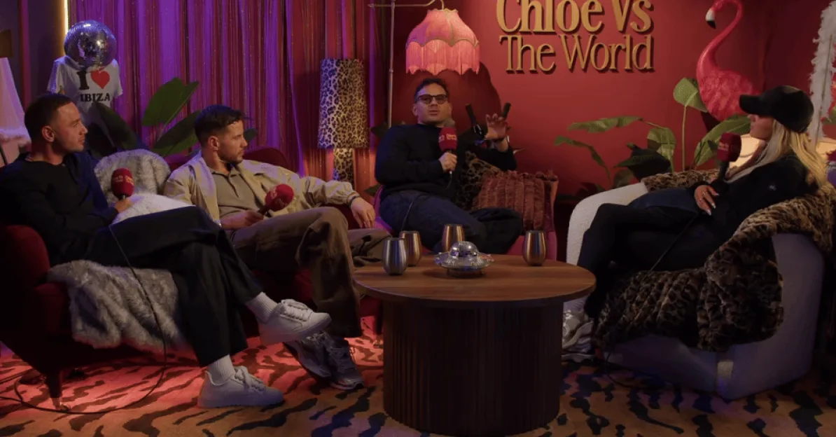 Four guests seated around a table for a podcast recording, with a "Chloe Vs The World" sign on the back wall.