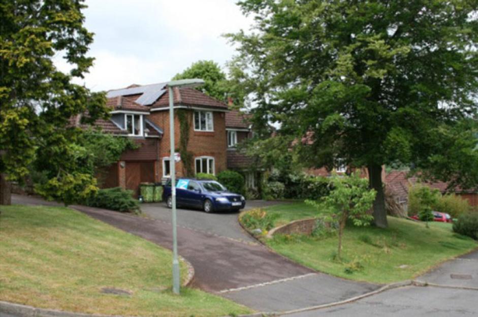 House of Alison and Darren Unsted, subject of a neighbors' row, with a blue car parked in the driveway.