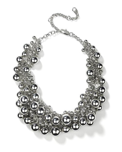 Silver-tone statement necklace with varying sizes of polished spheres attached to a chain.
