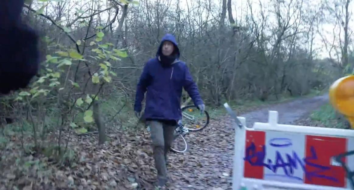 Furious Christian Brueckner Snatches Reporter’s Camera While Cycling to His Woodland Hideout