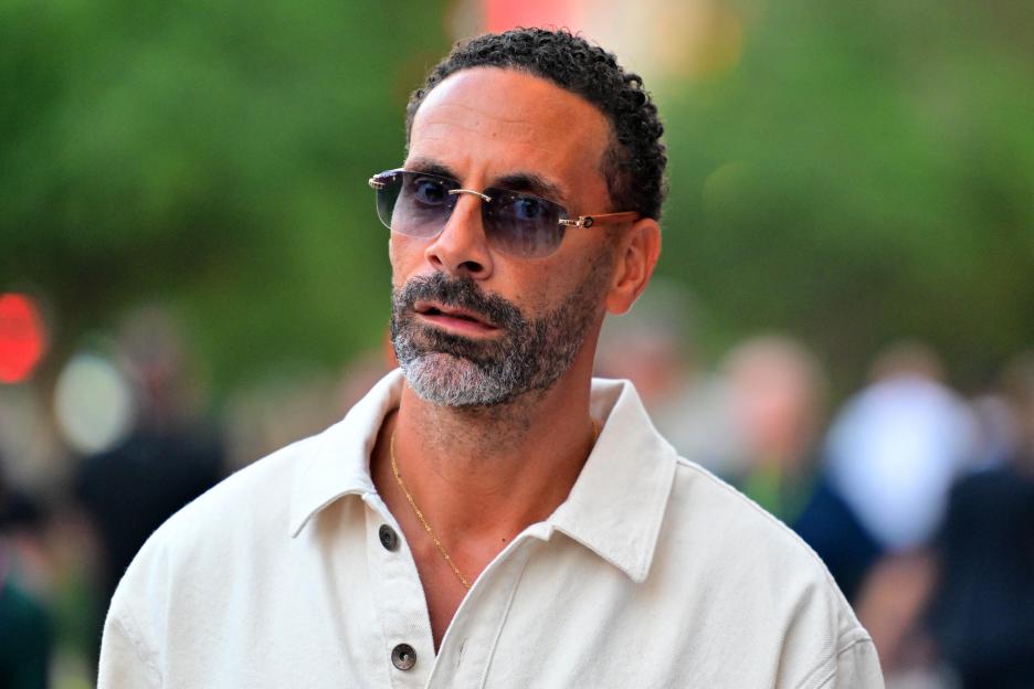 Former English footballer Rio Ferdinand walks in the paddock ahead of the Formula One Qatar Grand Prix.