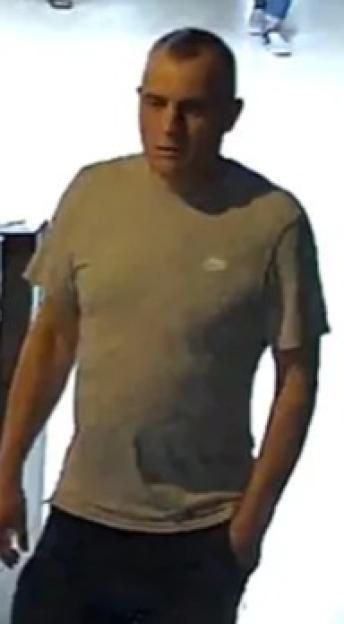 Collage of two images of a man with short brown hair, wearing a gray t-shirt and dark shorts, with his hands in his pockets.