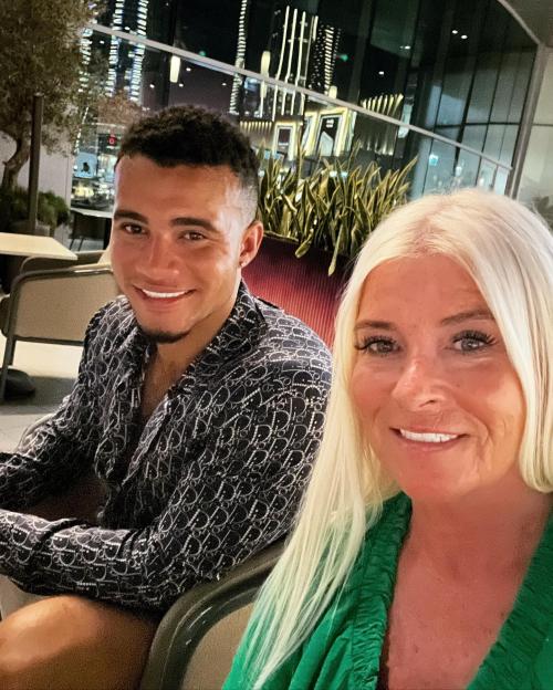 George Fensom smiling with fists raised.