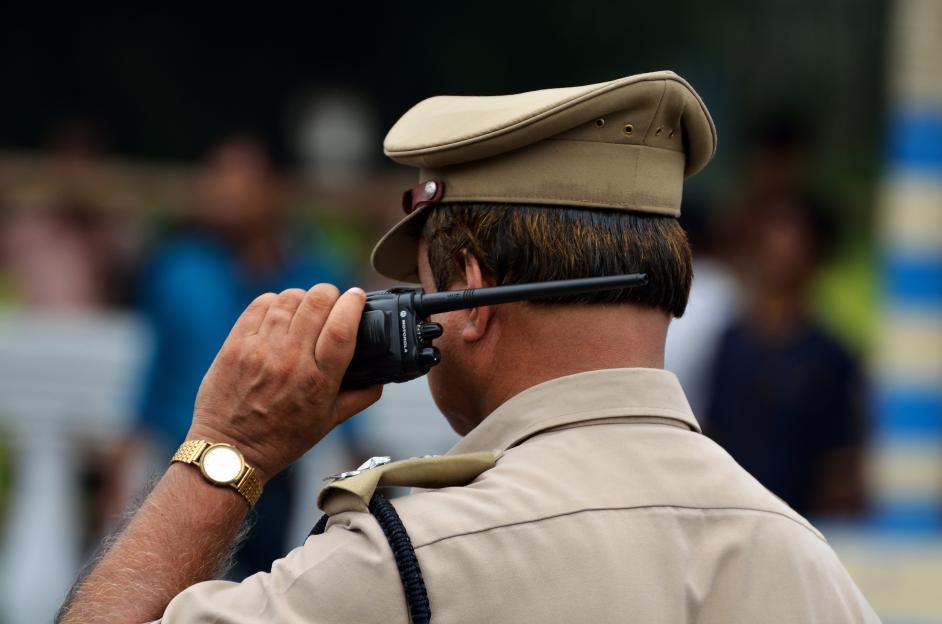 Indian police with walkie talkie
