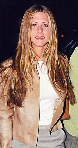 Jennifer Aniston and Brad Pitt posing at the "Erin Brockovich" Premiere.
