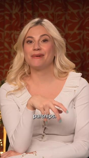 Pixie Lott, with blonde hair, light blue nail polish, and a white top, speaks.