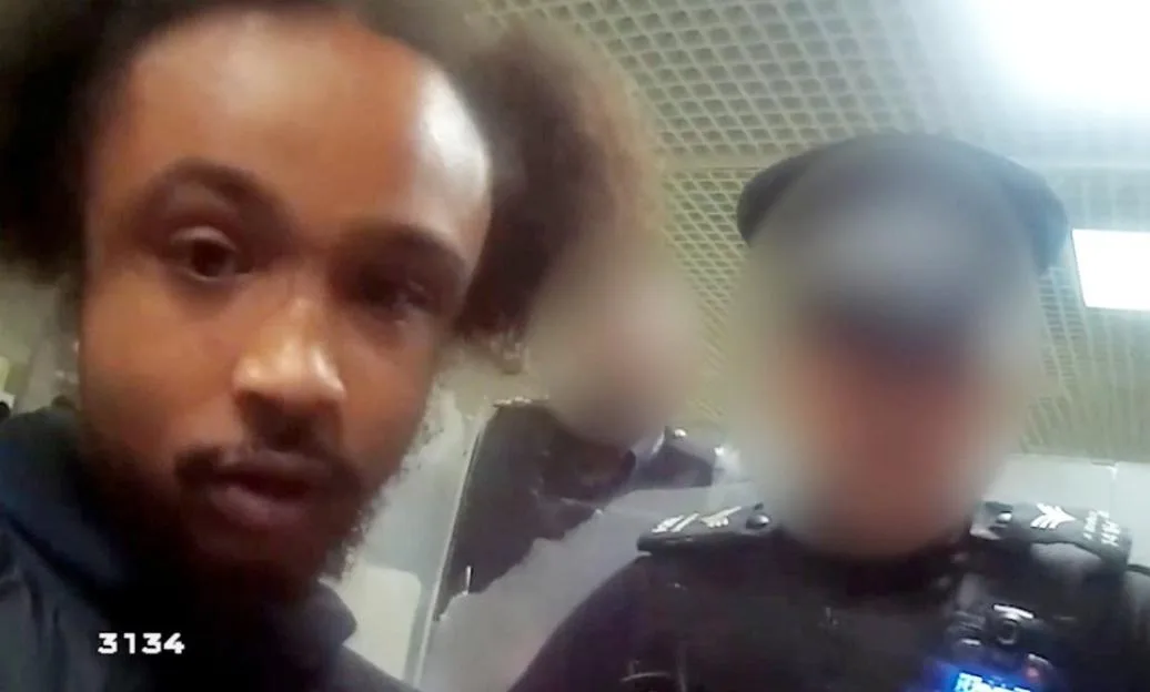 Shaylon McCalla being arrested by police at Birmingham Airport.
