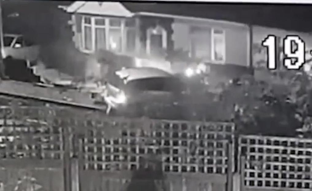 Video grab of a car crashing into a bungalow.