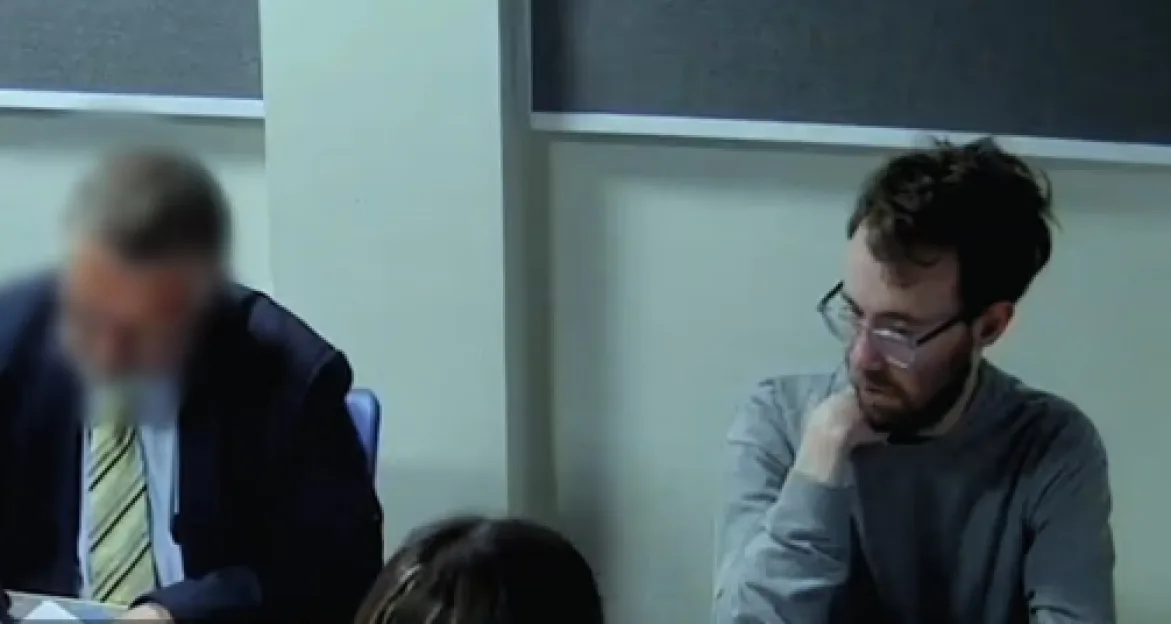 Joshua Powell sitting in a police interview room refusing to answer questions.