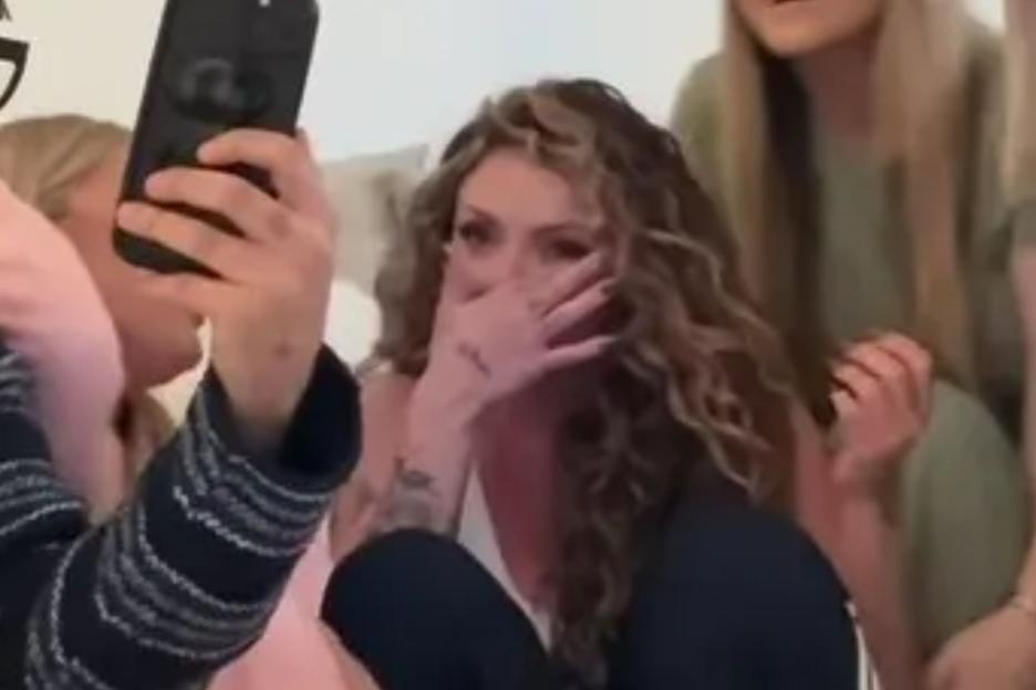 An image collage containing 1 images, Image 1 shows Jesy Nelson crying while watching a video with friends on a phone