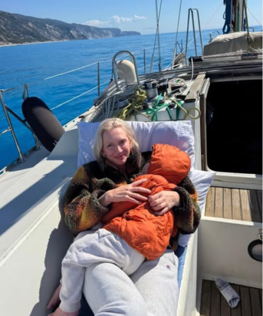 Renae Wasik holding her daughter Rocca on a boat.