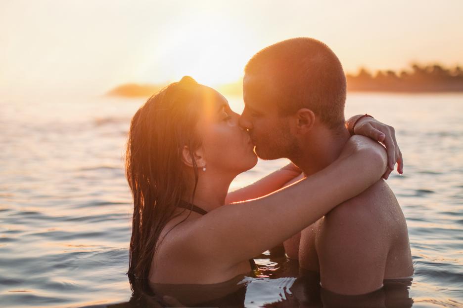 Young couple having fun at the beach