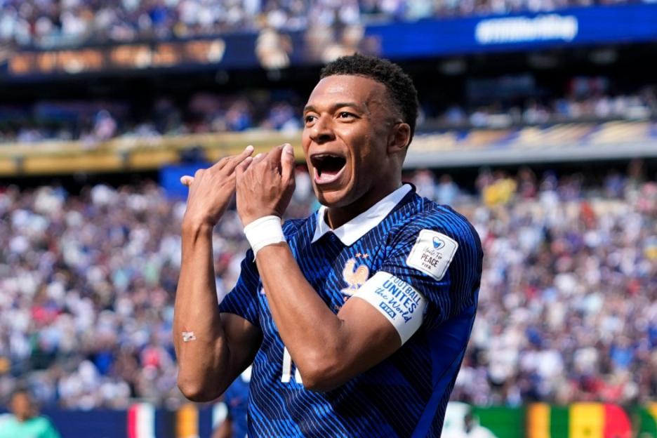 Soccer player Kylian Mbappe celebrating a goal.