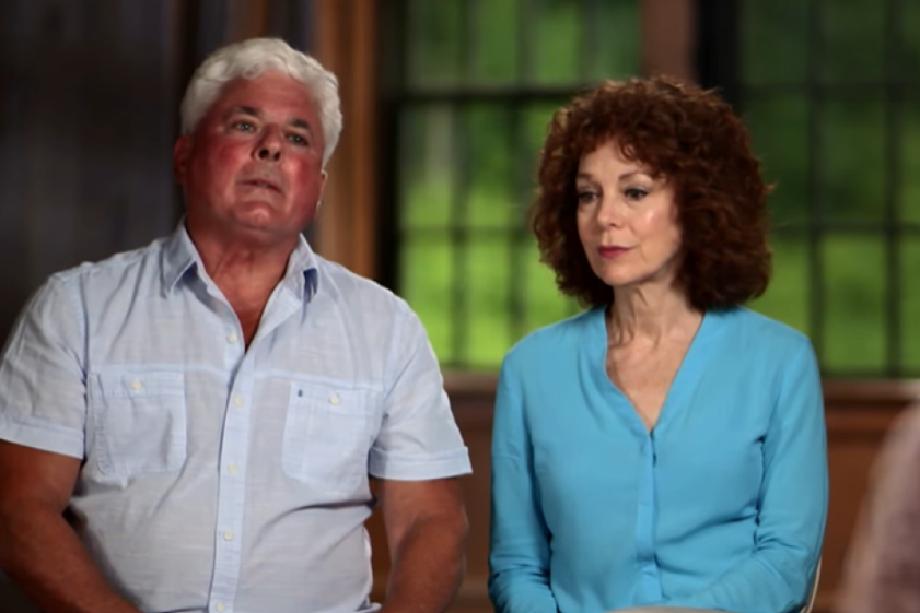 A man with white hair and a red-faced man in a light blue shirt looking up, and a woman with curly brown hair in a teal shirt looking to the right.