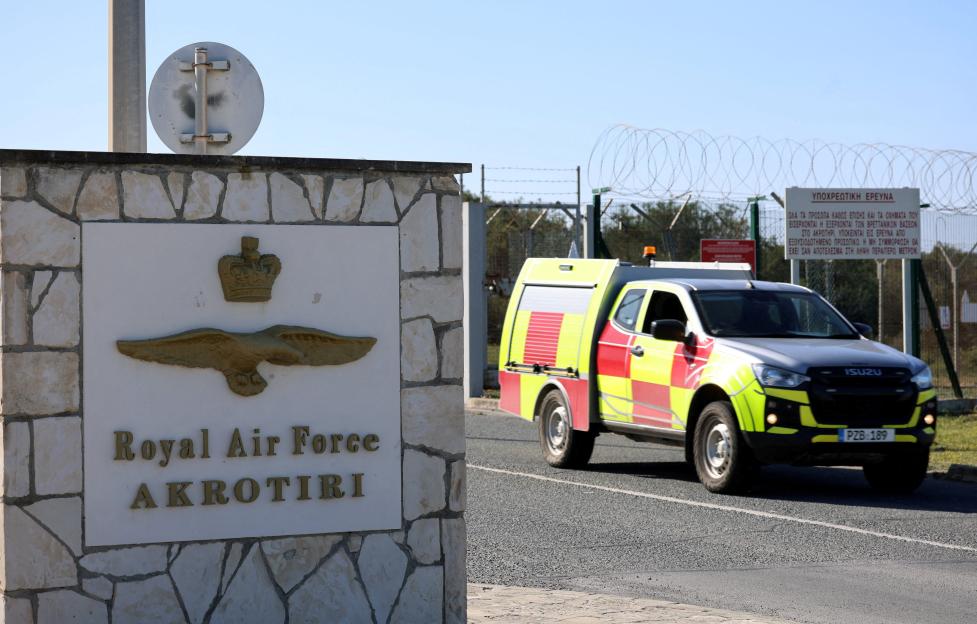 A car drives out of the entrance of RAF Akrotiri, a British sovereign base.