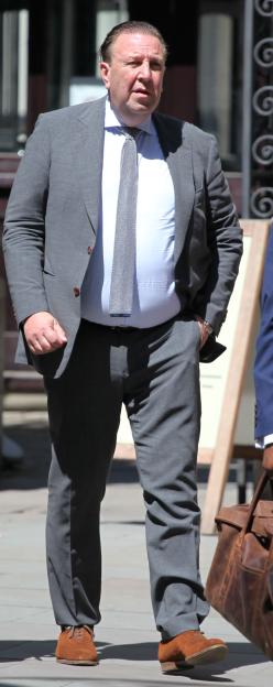 Tom Reimer stands outside the Central London County Court.
