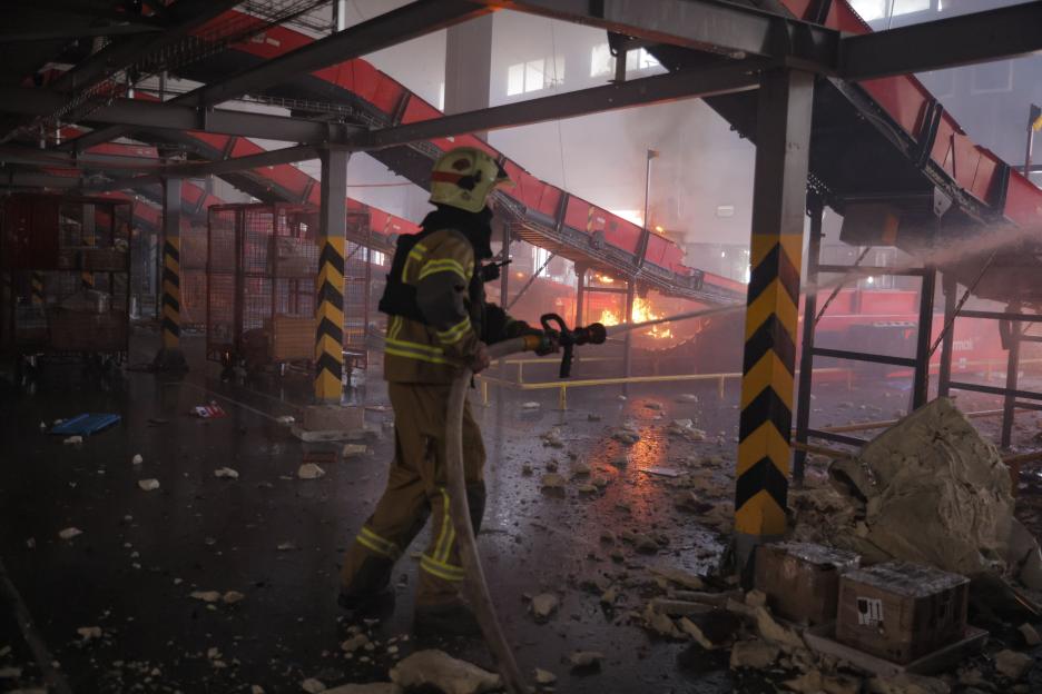 Firefighter Battles Blaze At Postal Terminal After Russian Drone Strike In Kharkiv Suburb, Ukraine - 02 Aug 2026