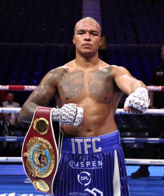 Fabio Wardley in boxing shorts and a championship belt over his left shoulder.