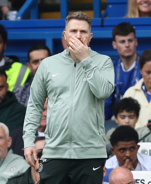 Chelsea manager Calum McFarlane looks disappointed.