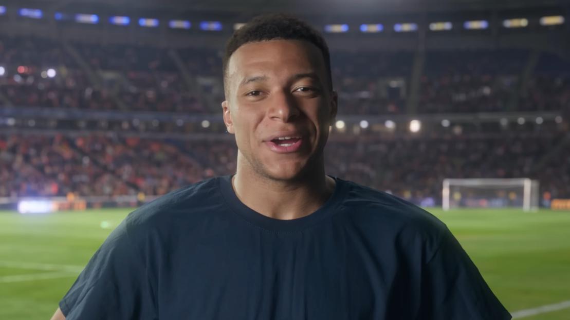 Kylian Mbappé on a soccer field.
