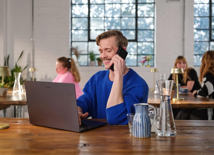 Stephen Libby on the phone with a Samsung Galaxy S26, working on a Samsung laptop.