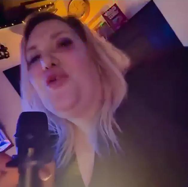Mel Bull doing karaoke.