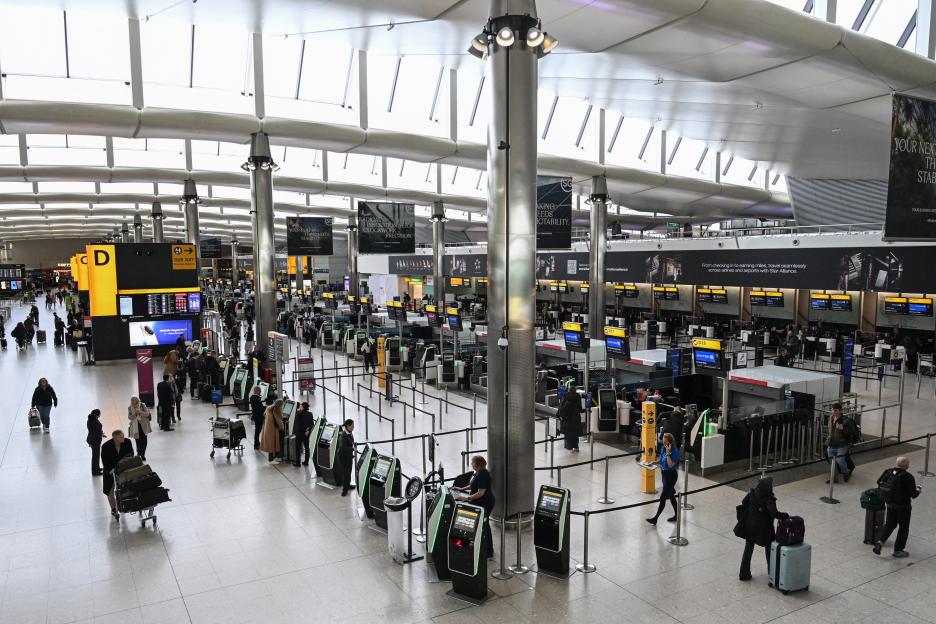 A quiet check-in area at London Heathrow Airport following severe flight disruptions.