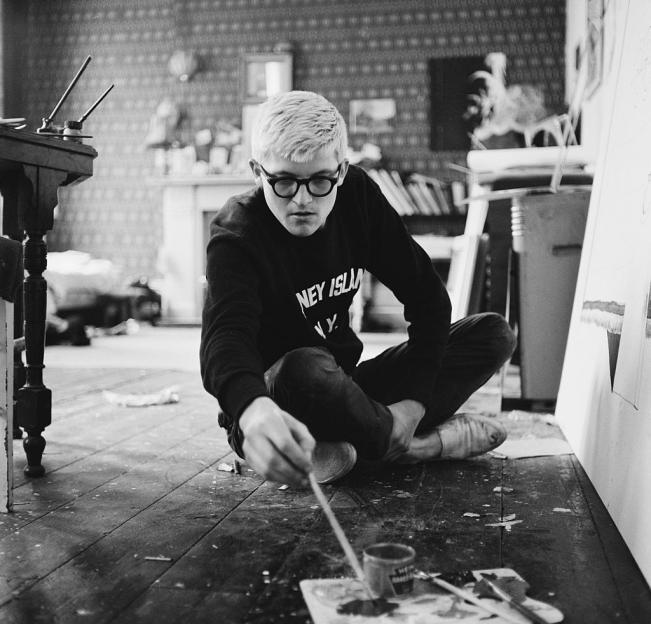 English artist David Hockney working in a studio.
