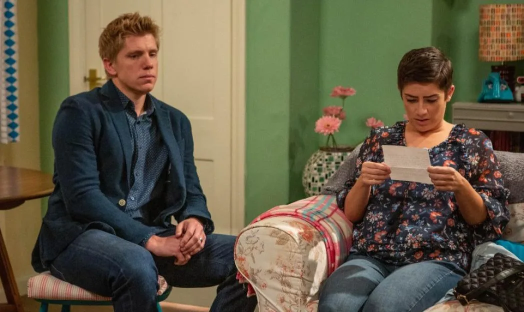 Victoria Barton reads a letter while Robert Sugden looks on.
