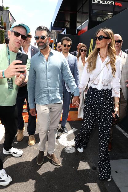 Donald Trump Jr. poses for a photo with a fan, with Bettina Anderson during the F1 Grand Prix of Monaco.