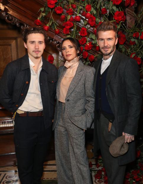 Brooklyn, Victoria, and David Beckham pose together at the Kent & Curwen presentation.