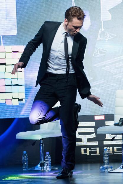 Actor Tom Hiddleston dances at the "Thor: The Dark World" premiere.