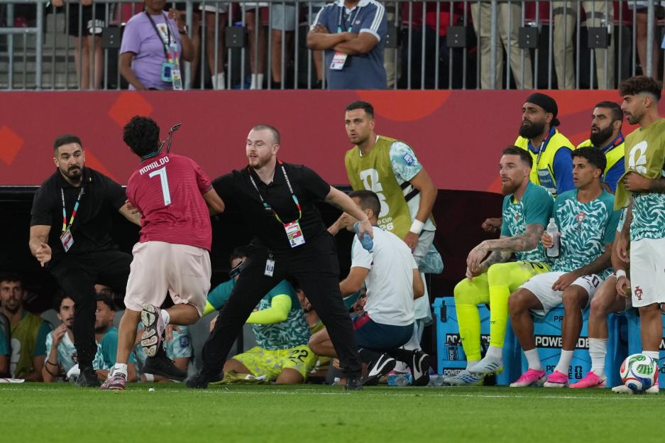 'World Cup Scare: Pitch Invader Gets Within Feet of Cristiano Ronaldo Before Being Removed'